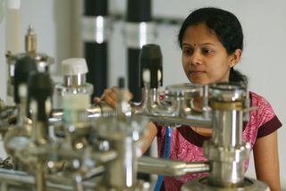 Researcher working on a device in the laboratory